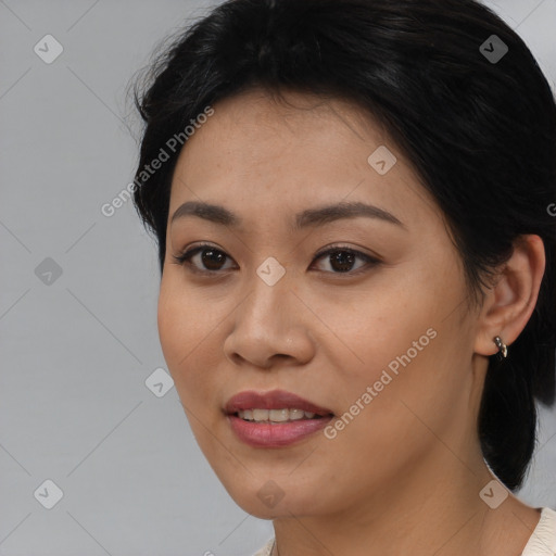 Joyful asian young-adult female with medium  black hair and brown eyes