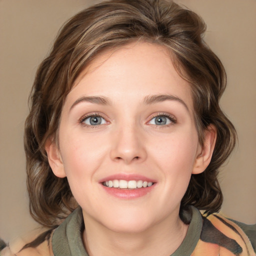 Joyful white young-adult female with medium  brown hair and green eyes