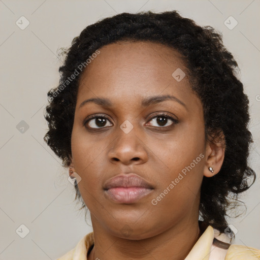 Neutral black young-adult female with medium  brown hair and brown eyes