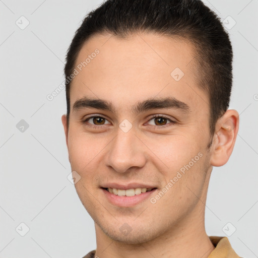 Joyful white young-adult male with short  brown hair and brown eyes