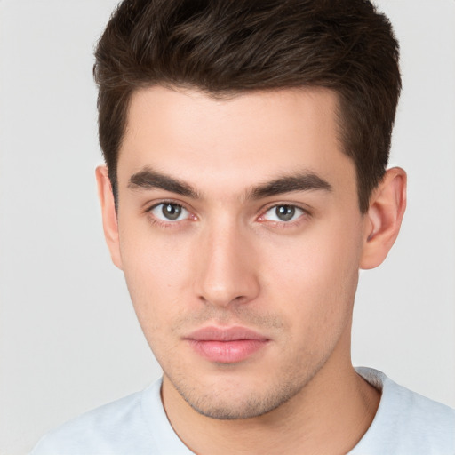 Neutral white young-adult male with short  brown hair and brown eyes