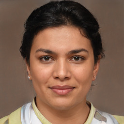 Joyful white young-adult female with medium  brown hair and brown eyes