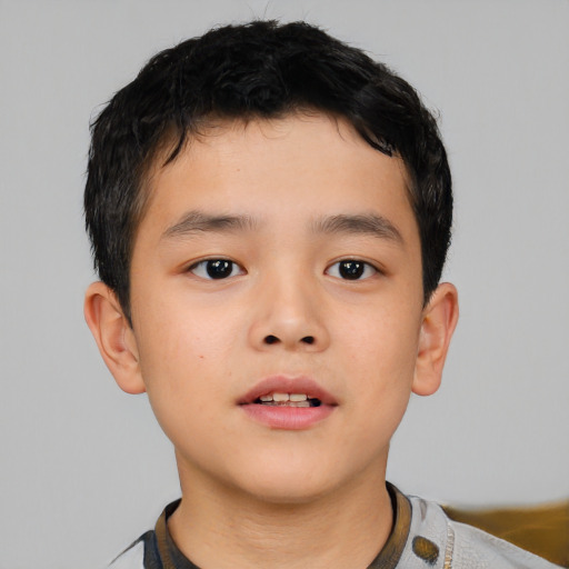 Neutral asian child male with short  brown hair and brown eyes