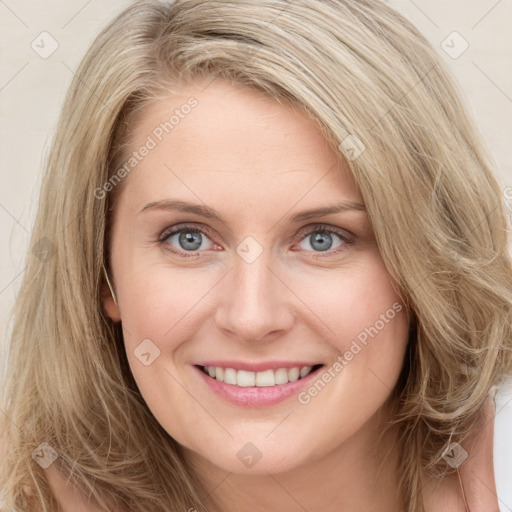 Joyful white young-adult female with long  brown hair and blue eyes