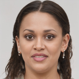 Joyful white young-adult female with long  brown hair and brown eyes