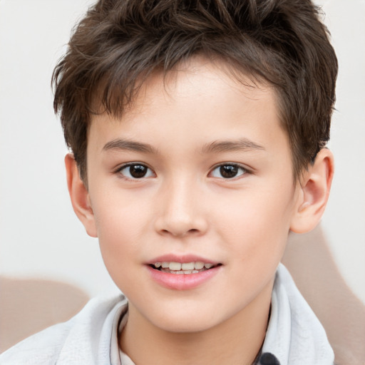 Joyful white child male with short  brown hair and brown eyes