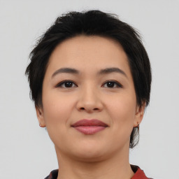 Joyful asian young-adult female with short  black hair and brown eyes