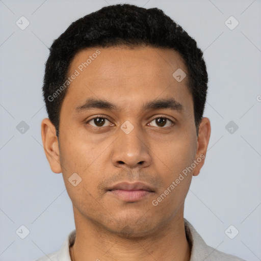 Neutral latino young-adult male with short  black hair and brown eyes