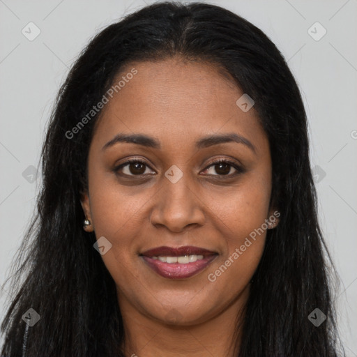 Joyful black young-adult female with long  brown hair and brown eyes