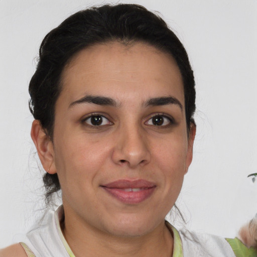 Joyful white adult female with short  brown hair and brown eyes