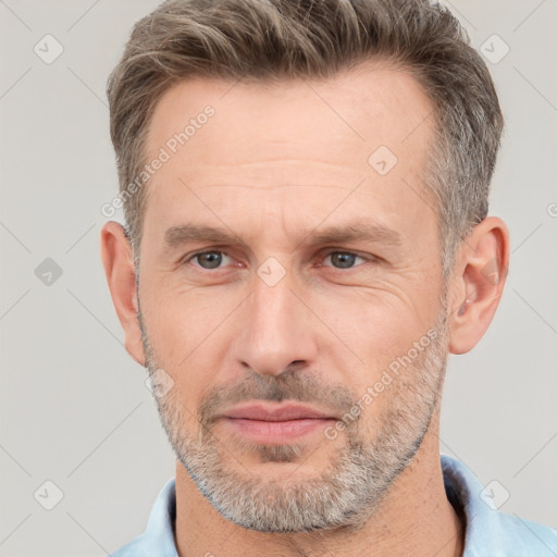 Neutral white adult male with short  brown hair and brown eyes