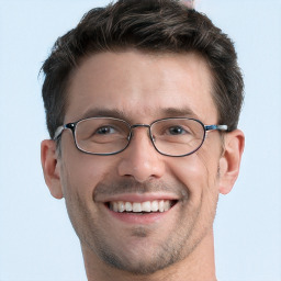 Joyful white adult male with short  brown hair and grey eyes