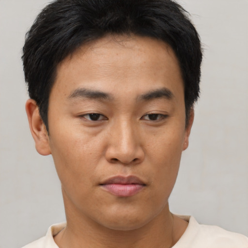 Neutral asian young-adult male with short  brown hair and brown eyes