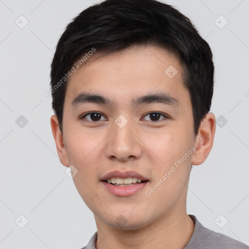 Joyful asian young-adult male with short  black hair and brown eyes