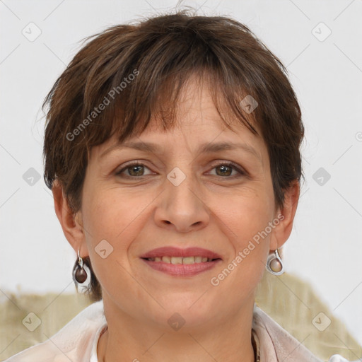 Joyful white adult female with short  brown hair and brown eyes