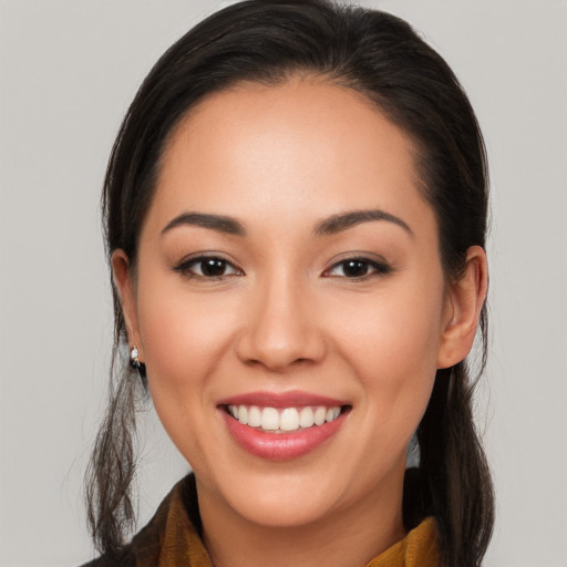 Joyful white young-adult female with long  brown hair and brown eyes