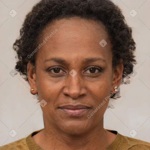 Joyful black adult female with short  brown hair and brown eyes