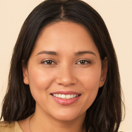 Joyful white young-adult female with long  brown hair and brown eyes