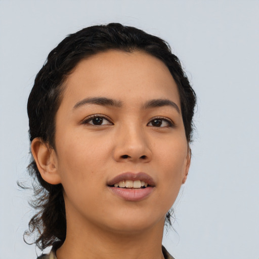 Joyful asian young-adult female with long  black hair and brown eyes
