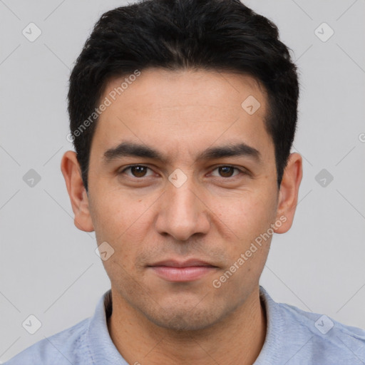 Joyful white young-adult male with short  black hair and brown eyes