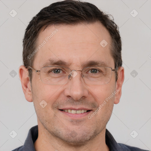 Joyful white adult male with short  brown hair and brown eyes