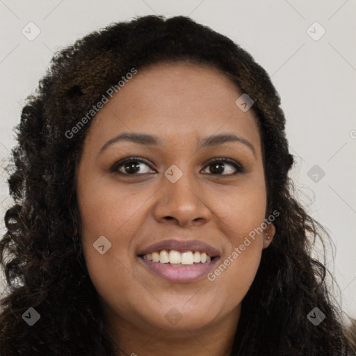 Joyful black young-adult female with long  brown hair and brown eyes