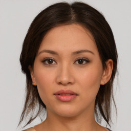 Neutral asian young-adult female with medium  brown hair and brown eyes