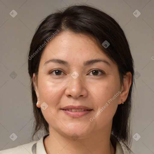 Joyful white adult female with medium  brown hair and brown eyes