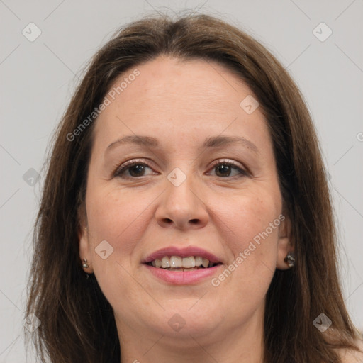 Joyful white adult female with long  brown hair and grey eyes