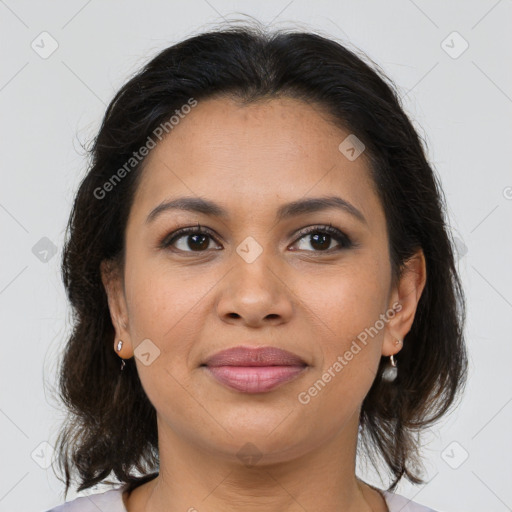 Joyful latino young-adult female with medium  brown hair and brown eyes