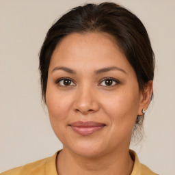 Joyful white young-adult female with medium  brown hair and brown eyes