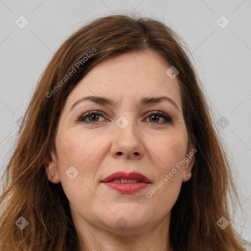 Joyful white adult female with long  brown hair and brown eyes