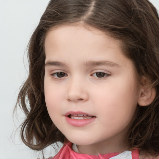 Joyful white child female with long  brown hair and brown eyes