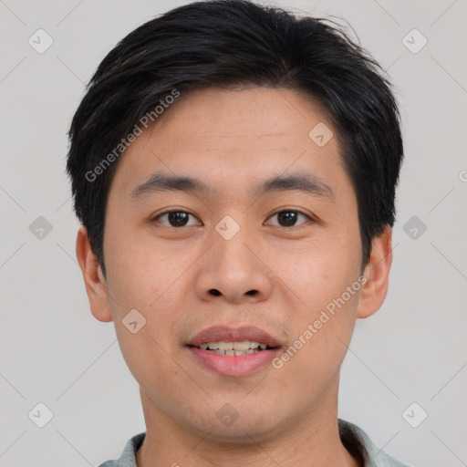 Joyful asian young-adult male with short  brown hair and brown eyes