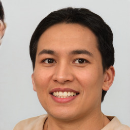 Joyful white young-adult male with short  black hair and brown eyes