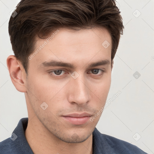 Neutral white young-adult male with short  brown hair and grey eyes