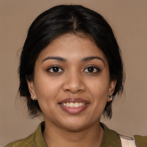 Joyful latino young-adult female with medium  black hair and brown eyes