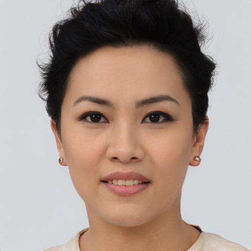 Joyful asian young-adult female with short  black hair and brown eyes