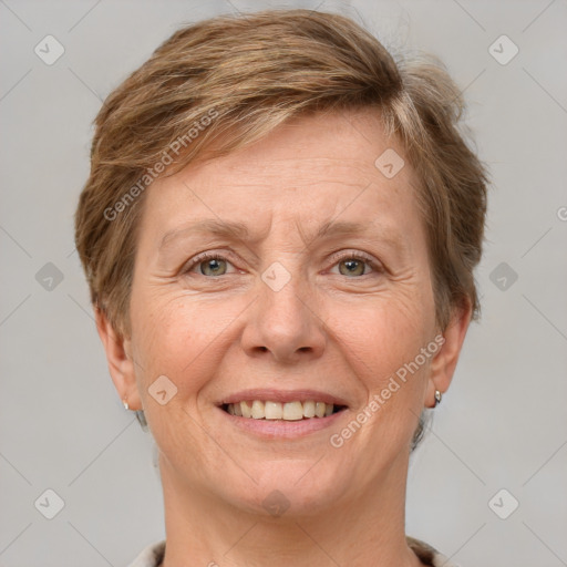 Joyful white adult female with short  brown hair and grey eyes