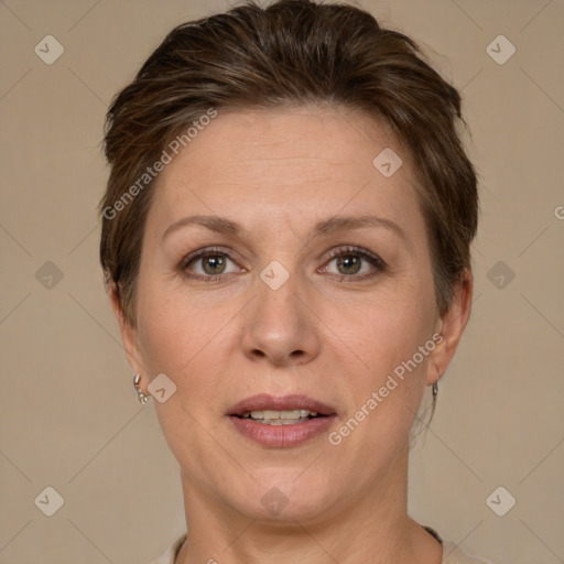 Joyful white adult female with short  brown hair and brown eyes