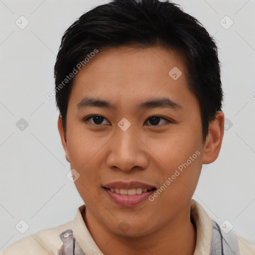 Joyful asian young-adult male with short  black hair and brown eyes