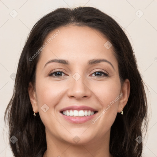 Joyful white young-adult female with long  brown hair and brown eyes