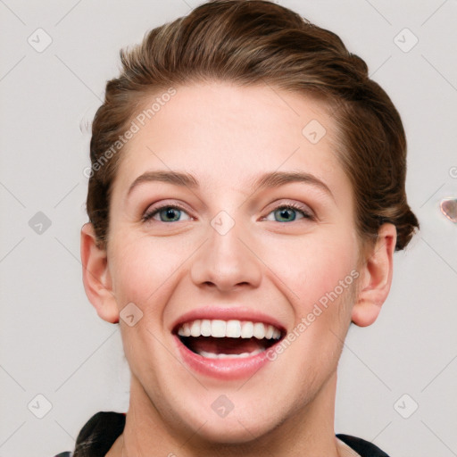 Joyful white young-adult female with short  brown hair and blue eyes