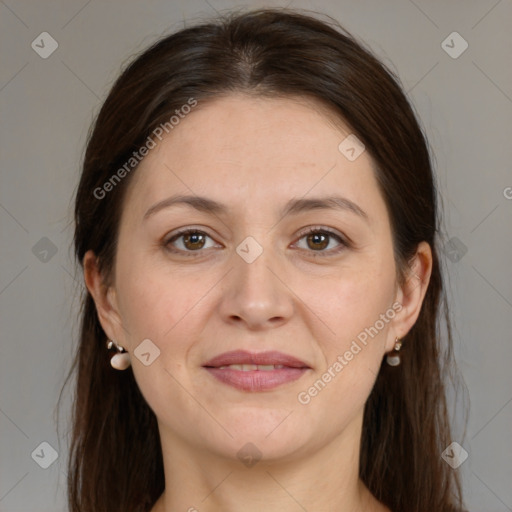 Joyful white adult female with medium  brown hair and brown eyes