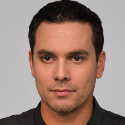 Neutral white young-adult male with short  black hair and brown eyes