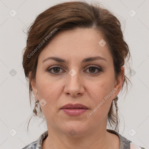 Joyful white adult female with medium  brown hair and grey eyes