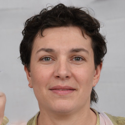 Joyful white adult female with short  brown hair and brown eyes