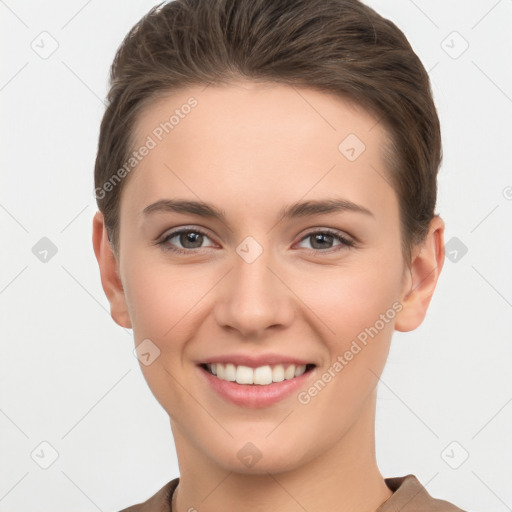 Joyful white young-adult female with short  brown hair and brown eyes