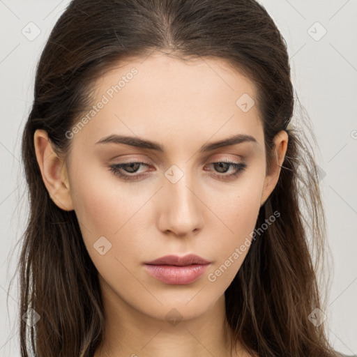 Neutral white young-adult female with long  brown hair and brown eyes