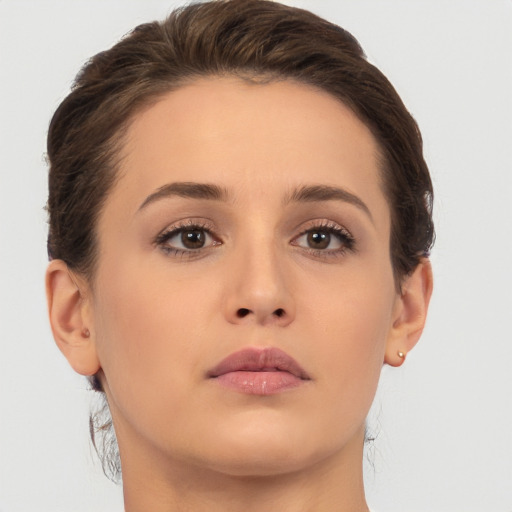 Neutral white young-adult female with medium  brown hair and brown eyes